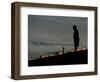 A New Orleans Resident Stands During a Candlelight Ceremony-Carlos Barria-Framed Photographic Print