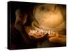 A Novice Monk Lighting Candles at a Massive Buddha Statue in Burma (Myanmar)-Kyle Hammons-Stretched Canvas