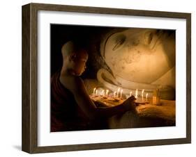 A Novice Monk Lighting Candles at a Massive Buddha Statue in Burma (Myanmar)-Kyle Hammons-Framed Photographic Print