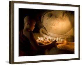 A Novice Monk Lighting Candles at a Massive Buddha Statue in Burma (Myanmar)-Kyle Hammons-Framed Photographic Print