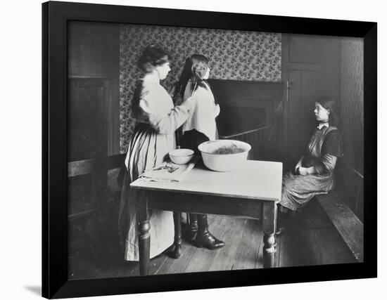 A Nurse Examines Girls Hair, Central Street Cleansing Station, London, 1914-null-Framed Photographic Print