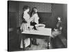 A Nurse Examines Girls Hair, Central Street Cleansing Station, London, 1914-null-Stretched Canvas