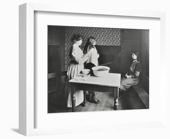 A Nurse Examines Girls Hair, Central Street Cleansing Station, London, 1914-null-Framed Photographic Print