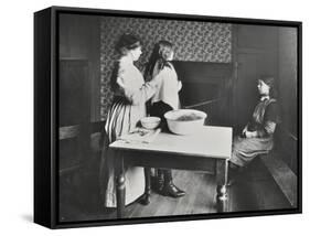 A Nurse Examines Girls Hair, Central Street Cleansing Station, London, 1914-null-Framed Stretched Canvas