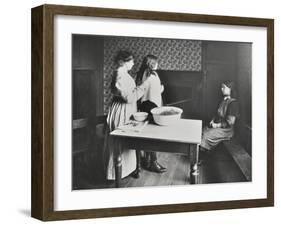 A Nurse Examines Girls Hair, Central Street Cleansing Station, London, 1914-null-Framed Premium Photographic Print