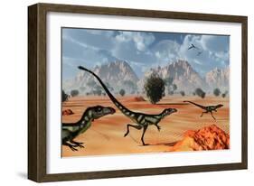 A Pack of Dilong Tyrannosaurid Dinosaurs Hunting-null-Framed Art Print