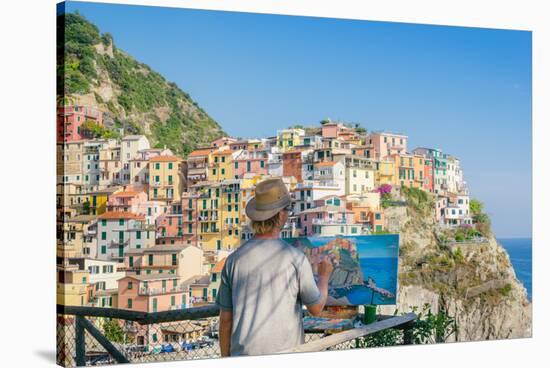 A painter at Manarola, Cinque Terre, UNESCO World Heritage Site, Liguria, Italian Riviera, Italy, E-Alexandre Rotenberg-Stretched Canvas