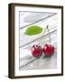 A Pair of Cherries with a Leaf on a Wooden Table-Jürgen Klemme-Framed Photographic Print