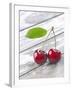 A Pair of Cherries with a Leaf on a Wooden Table-Jürgen Klemme-Framed Photographic Print