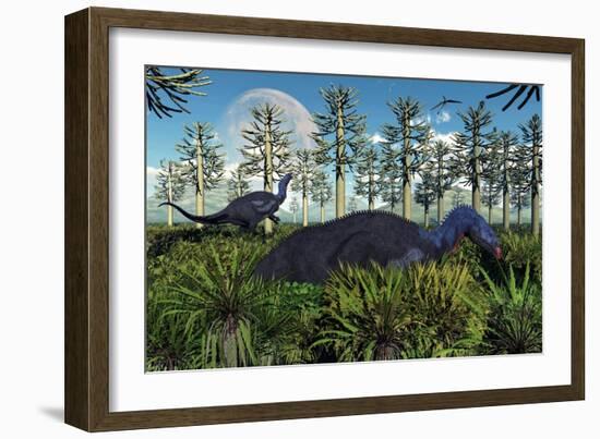 A Pair of Herbivorous Camptosaurus Dinosaurs Grazing-null-Framed Art Print