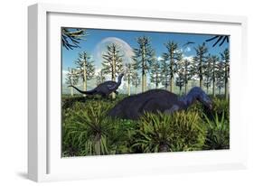 A Pair of Herbivorous Camptosaurus Dinosaurs Grazing-null-Framed Art Print