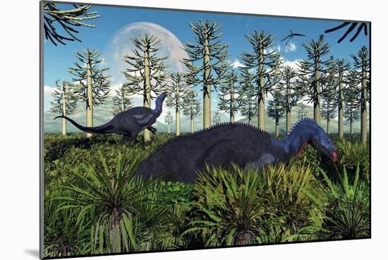 A Pair of Herbivorous Camptosaurus Dinosaurs Grazing-null-Mounted Art Print