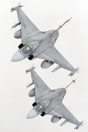 https://imgc.allpostersimages.com/img/posters/a-pair-of-hungarian-air-force-jas-39-gripen-over-lithuania_u-L-Q12STIY0.jpg?artPerspective=n