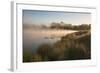 A Pair of Mute Swans, Cygnus Olor, Swim over a Misty Pen Pond at Sunrise in Richmond Park-Alex Saberi-Framed Photographic Print