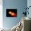 A Pair of Neutron Stars Colliding, Merging, and Forming a Black Hole-null-Art Print displayed on a wall