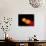 A Pair of Neutron Stars Colliding, Merging, and Forming a Black Hole-null-Art Print displayed on a wall