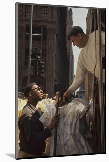 A Pair of Push Boys Unload Racks of Dresses on 7th Avenue, New York, New York, 1960-Walter Sanders-Mounted Photographic Print