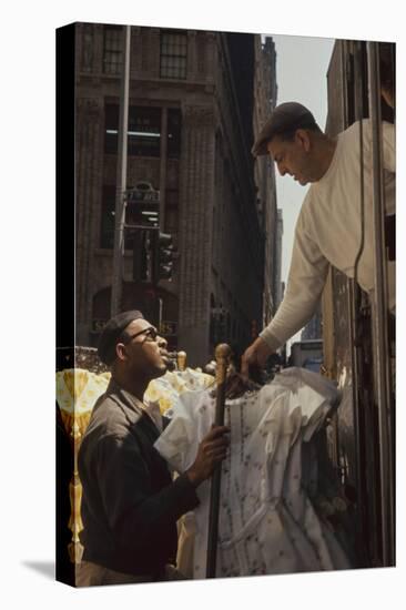 A Pair of Push Boys Unload Racks of Dresses on 7th Avenue, New York, New York, 1960-Walter Sanders-Stretched Canvas