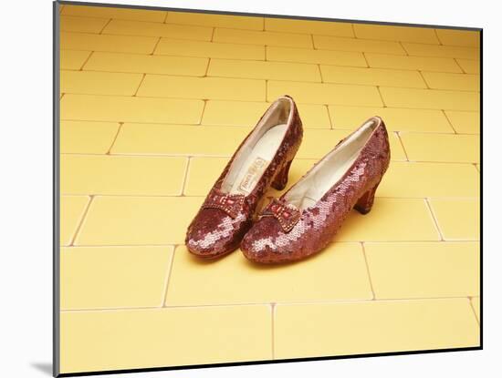 A Pair of Ruby Slippers Worn by Judy Garland in the 1939 MGM film "The Wizard of Oz"-null-Mounted Giclee Print