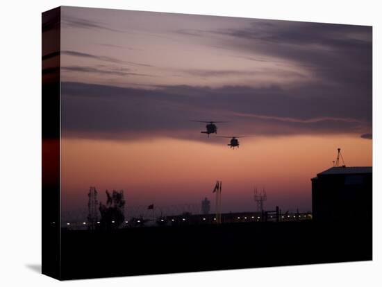 A Pair of UH-60 Black Hawk Helicopters Approach their Landing in Baghdad, Iraq-null-Stretched Canvas