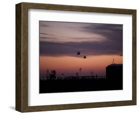 A Pair of UH-60 Black Hawk Helicopters Approach their Landing in Baghdad, Iraq-null-Framed Photographic Print