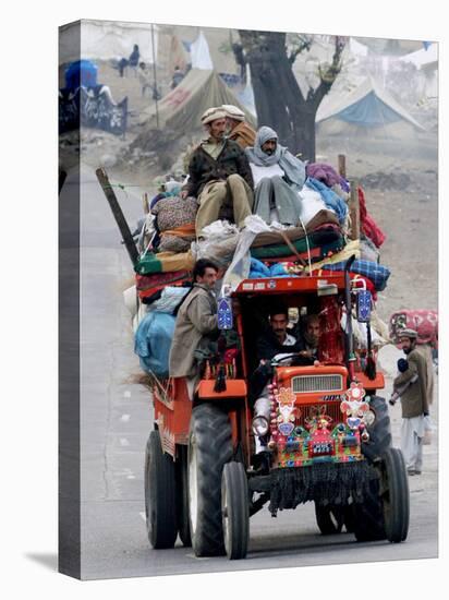 A Pakistan Earthquake Survivor Family Ride a Vehicle as They Make Their Way to Mansehra-null-Stretched Canvas