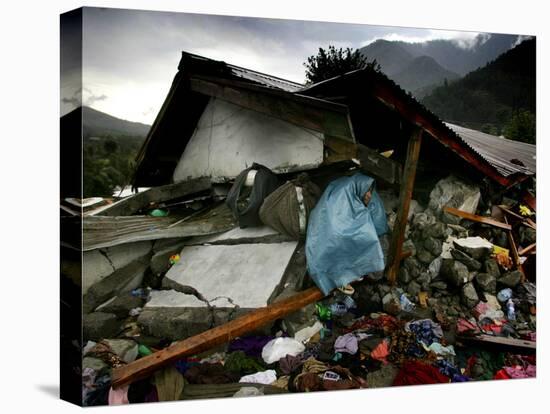 A Pakistani Earthquake Survivor Takes Shelter from the Rain-null-Stretched Canvas