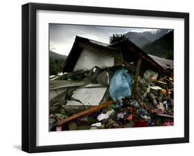 A Pakistani Earthquake Survivor Takes Shelter from the Rain-null-Framed Photographic Print