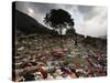 A Pakistani Refugee Walks Past Clothing Left Strewn on the Ground-null-Stretched Canvas