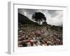 A Pakistani Refugee Walks Past Clothing Left Strewn on the Ground-null-Framed Photographic Print