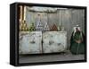 A Palestinian Sits Near the Stand of a Street Seller Displaying Goods for Sale-null-Framed Stretched Canvas