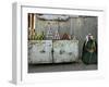 A Palestinian Sits Near the Stand of a Street Seller Displaying Goods for Sale-null-Framed Photographic Print