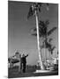 A Pan American Pilot and Flight Attendant the Edge of the Tarmac at Miami International Airport-null-Mounted Photographic Print