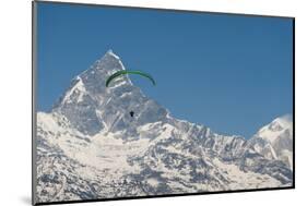 A Paraglider Hangs in Air with Dramatic Peak of Machapuchare (Fishtail Mountain) in Distance-Alex Treadway-Mounted Photographic Print