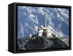 A Partial View of Space Shuttle Atlantis Backdropped by a Blue and White Earth-null-Framed Stretched Canvas