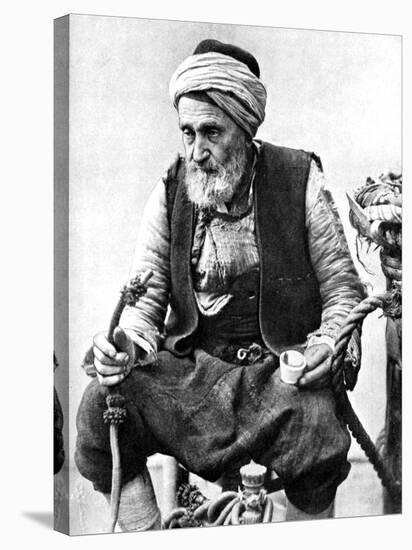 A Peasant Drinking Coffee and Smoking a Huqqah, Izmir, Turkey, 1936-null-Stretched Canvas