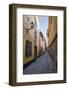 A pedestrian walks the streets of Stockholm's colorful and historic Gamla Stan district, Stockholm,-Jon Reaves-Framed Photographic Print