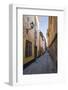 A pedestrian walks the streets of Stockholm's colorful and historic Gamla Stan district, Stockholm,-Jon Reaves-Framed Photographic Print