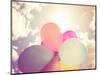 A Person Holding Multi Colored Balloons Done with a Retro Vintage Instagram Filter Effect-graphicphoto-Mounted Photographic Print