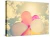 A Person Holding Multi Colored Balloons Done with a Retro Vintage Instagram Filter-graphicphoto-Stretched Canvas