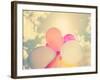 A Person Holding Multi Colored Balloons Done with a Retro Vintage Instagram Filter-graphicphoto-Framed Photographic Print