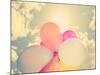 A Person Holding Multi Colored Balloons Done with a Retro Vintage Instagram Filter-graphicphoto-Mounted Photographic Print