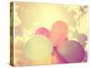 A Person Holding Multi Colored Balloons Toned with a Retro Vintage Instagram like Filter-graphicphoto-Stretched Canvas