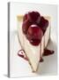 A Piece of Cheesecake with Cherry Sauce-null-Stretched Canvas