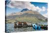 A pier and boat at the base of Volcan Imbabura and Lago San Pablo, close to the famous market town -Alexandre Rotenberg-Stretched Canvas