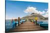 A pier and boat on Lago San Pablo, at the base of Volcan Imbabura, close to the famous market town-Alexandre Rotenberg-Stretched Canvas