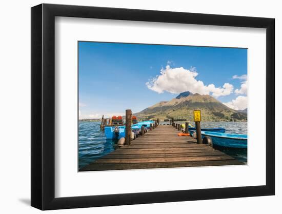 A pier and boat on Lago San Pablo, at the base of Volcan Imbabura, close to the famous market town-Alexandre Rotenberg-Framed Photographic Print