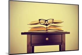 A Pile of Books and a Pair of Eyeglasses on a Desk, Symbolizing the Concept of Reading Habit or Stu-nito-Mounted Photographic Print
