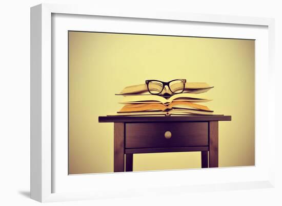 A Pile of Books and a Pair of Eyeglasses on a Desk, Symbolizing the Concept of Reading Habit or Stu-nito-Framed Photographic Print