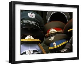 A Pile of Communist Era Army and Police Hats for Sale as Souvenirs, Mitte, Berlin, Germany-Richard Nebesky-Framed Photographic Print